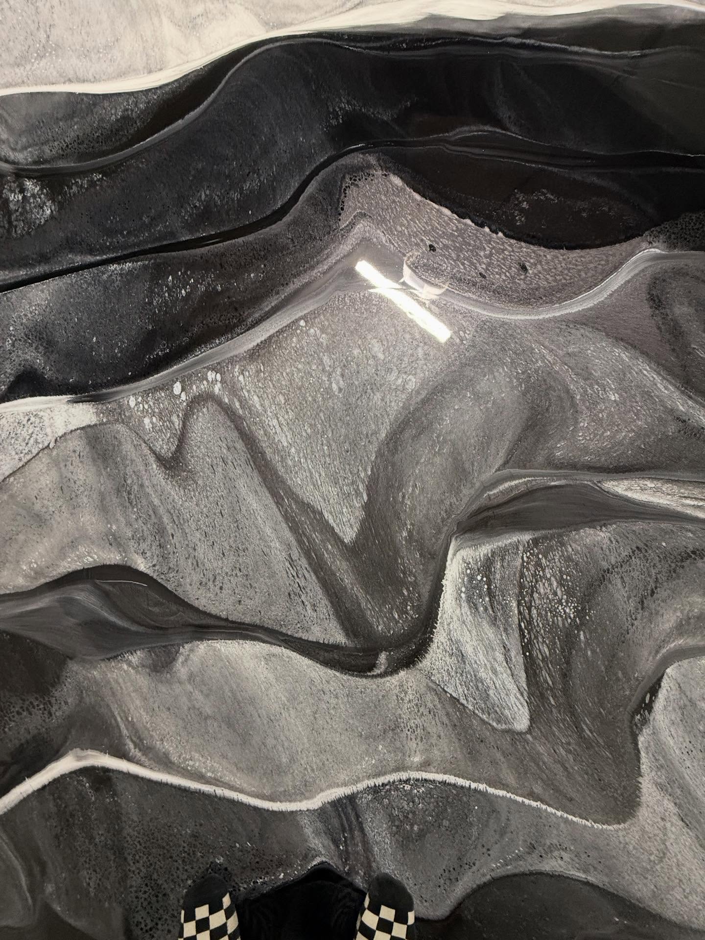 Horizontal banding of pewter and obsidian metallic epoxy floor in a Los Angeles residential garage